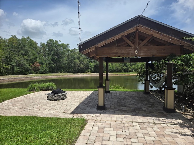 31141 Harthorn Ct, Wesley Chapel, FL 33543 - view of patio with a fire pit, a water view, and a gazebo