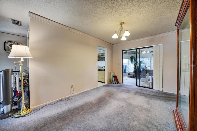 2817 Rustic Oaks Dr, Palm Harbor, FL 34684 - spare room featuring a textured ceiling, a chandelier, crown molding, and carpet