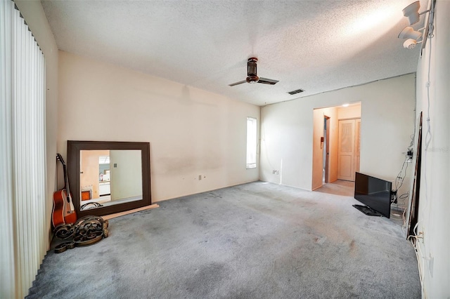 2817 Rustic Oaks Dr, Palm Harbor, FL 34684 - unfurnished bedroom with carpet, a textured ceiling, and a ceiling fan