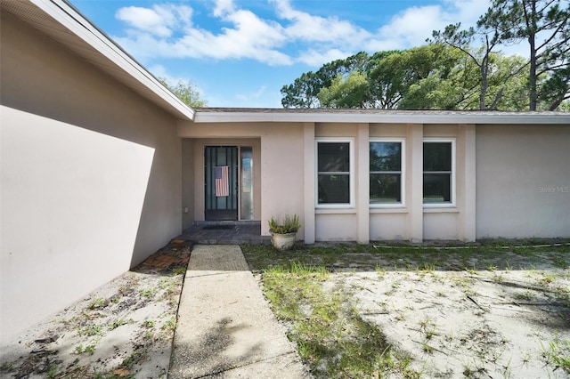 2817 Rustic Oaks Dr, Palm Harbor, FL 34684 - entrance to property with stucco siding