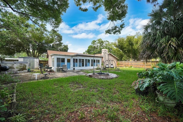 2817 Rustic Oaks Dr, Palm Harbor, FL 34684 - rear view of property with a storage shed, a patio area, and stucco siding