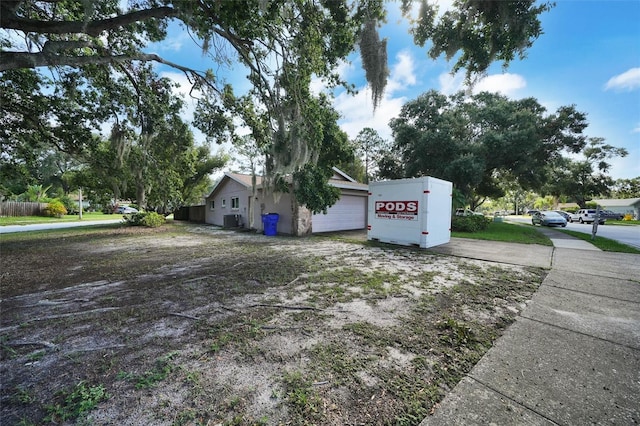 2817 Rustic Oaks Dr, Palm Harbor, FL 34684 - view of home's exterior featuring a garage and driveway
