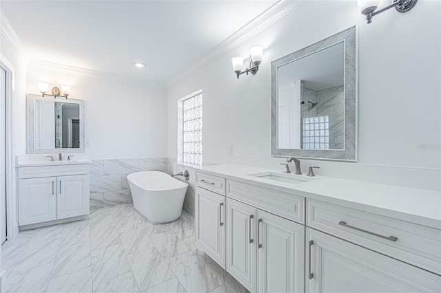 5950 Bikini Way N, St Pete Beach, FL 33706 - full bathroom with ornamental molding, two vanities, a soaking tub, marble finish floors, and a tile shower