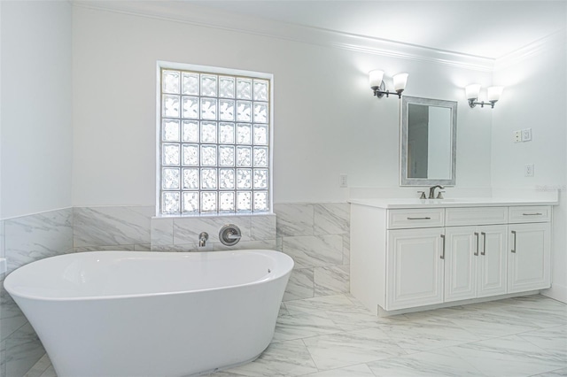 5950 Bikini Way N, St Pete Beach, FL 33706 - full bathroom featuring a soaking tub, vanity, plenty of natural light, ornamental molding, and marble finish flooring