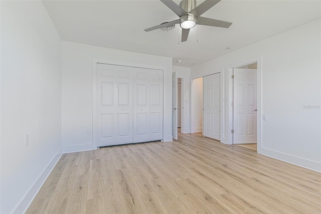 5950 Bikini Way N, St Pete Beach, FL 33706 - unfurnished bedroom featuring light wood-type flooring and ceiling fan