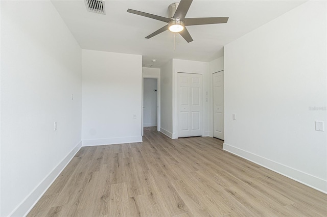 5950 Bikini Way N, St Pete Beach, FL 33706 - spare room featuring light wood-style flooring and ceiling fan