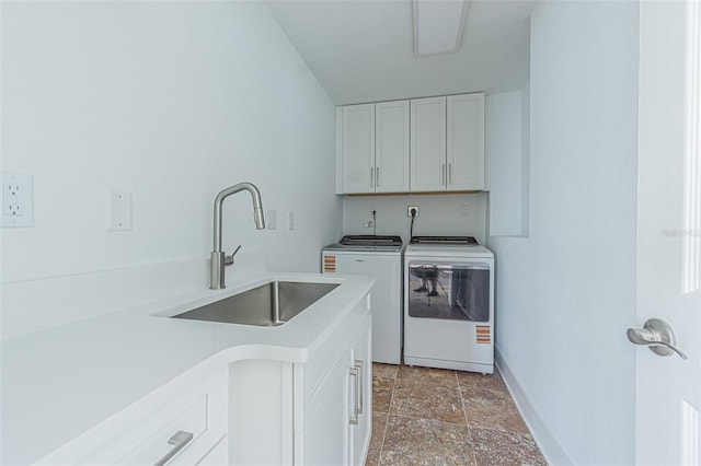 5950 Bikini Way N, St Pete Beach, FL 33706 - laundry room with independent washer and dryer, cabinet space, and light stone finish floors