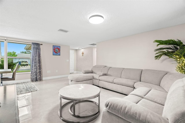 6715 Ranchwood Loop, New Port Richey, FL 34653 - living area featuring baseboards and a textured ceiling