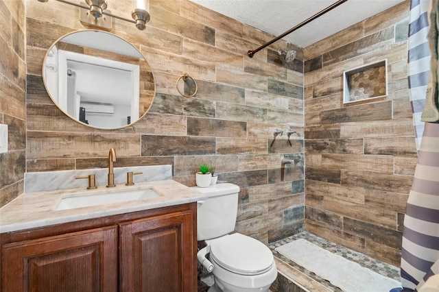 6715 Ranchwood Loop, New Port Richey, FL 34653 - full bathroom with a tile shower, vanity, a textured ceiling, and tile walls