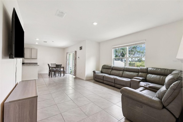 33657 Field Maple Loop, Wesley Chapel, FL 33545 - living room featuring light tile patterned flooring and recessed lighting