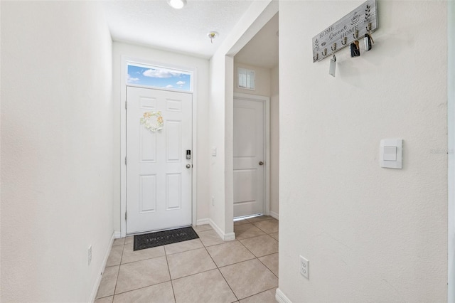 33657 Field Maple Loop, Wesley Chapel, FL 33545 - foyer with light tile patterned floors and baseboards