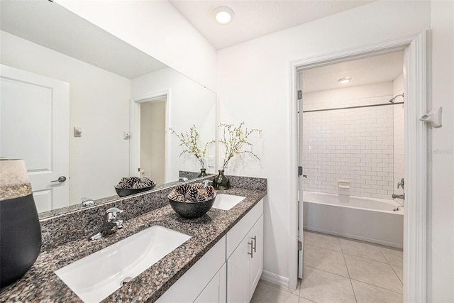 6347 Ten Acre Ct, Zephyrhills, FL 33541 - bathroom featuring double vanity, tile patterned floors, and tub / shower combination