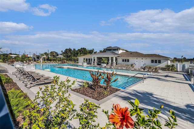 6347 Ten Acre Ct, Zephyrhills, FL 33541 - community pool featuring a patio