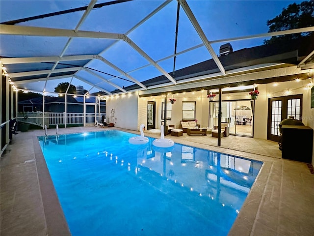 4617 Basswood St, Land O Lakes, FL 34639 - swimming pool with french doors, outdoor lounge area, a patio, and a lanai
