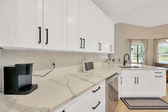 4617 Basswood St, Land O Lakes, FL 34639 - kitchen with dishwasher, a peninsula, white cabinets, and tasteful backsplash