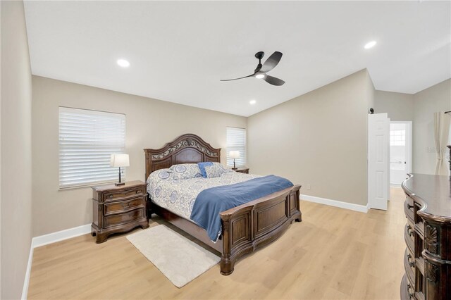 4617 Basswood St, Land O Lakes, FL 34639 - bedroom featuring light wood-style floors, ceiling fan, vaulted ceiling, and recessed lighting