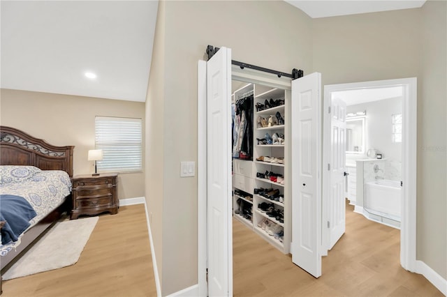 4617 Basswood St, Land O Lakes, FL 34639 - bedroom with light wood finished floors and baseboards
