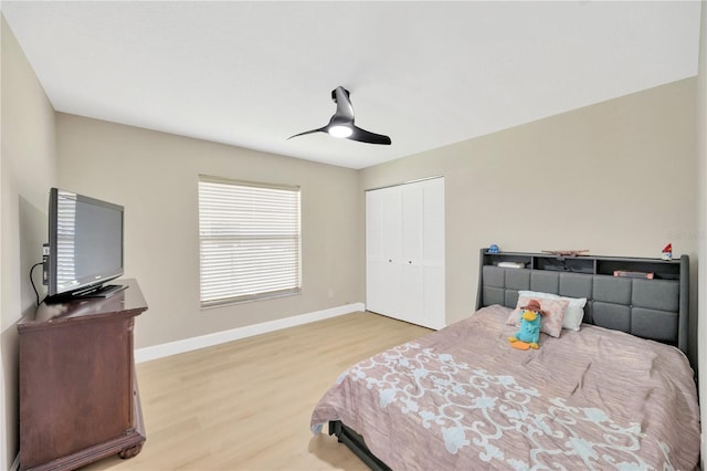 4617 Basswood St, Land O Lakes, FL 34639 - bedroom with light wood-type flooring, a closet, and ceiling fan