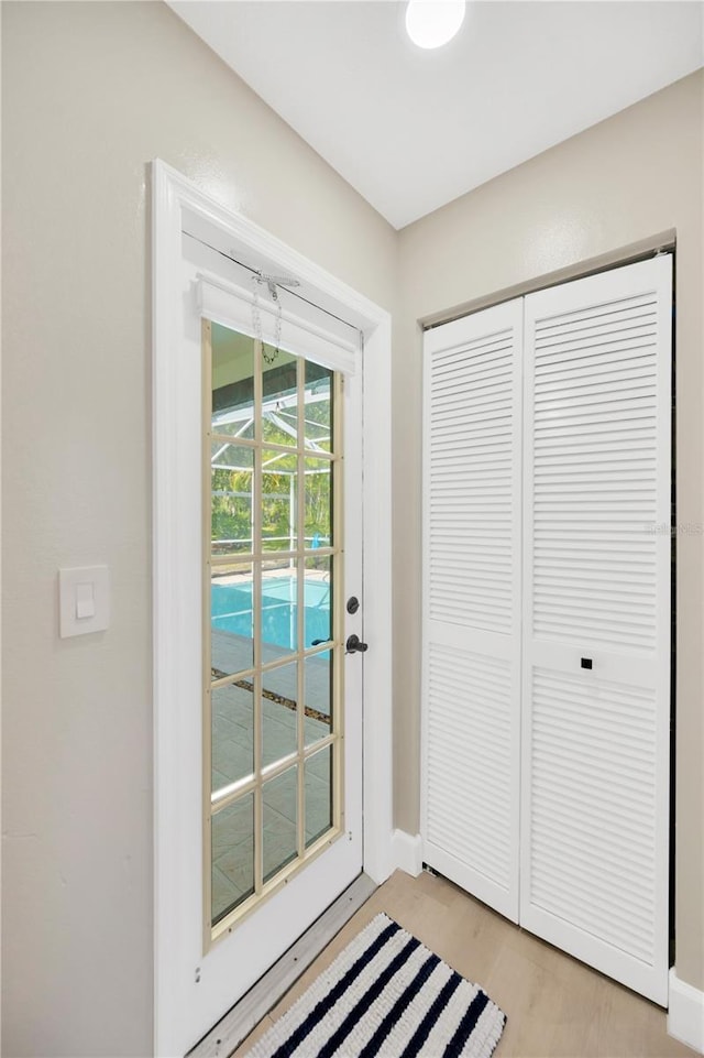 4617 Basswood St, Land O Lakes, FL 34639 - entryway with baseboards and light wood-style flooring