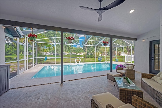 4617 Basswood St, Land O Lakes, FL 34639 - swimming pool featuring outdoor lounge area, a patio area, a lanai, and a ceiling fan