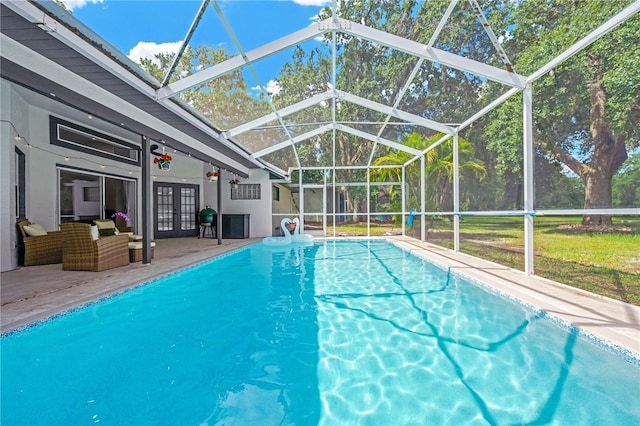 4617 Basswood St, Land O Lakes, FL 34639 - swimming pool featuring french doors, a lanai, and a patio