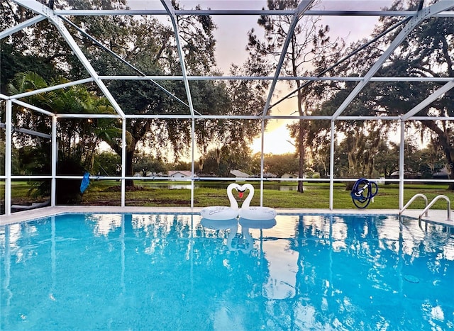 4617 Basswood St, Land O Lakes, FL 34639 - outdoor pool featuring a lanai and a yard