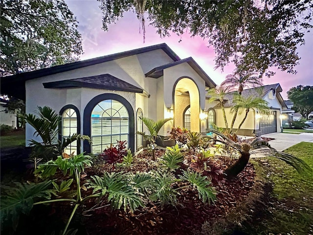 4617 Basswood St, Land O Lakes, FL 34639 - view of front of property with concrete driveway, stucco siding, and an attached garage