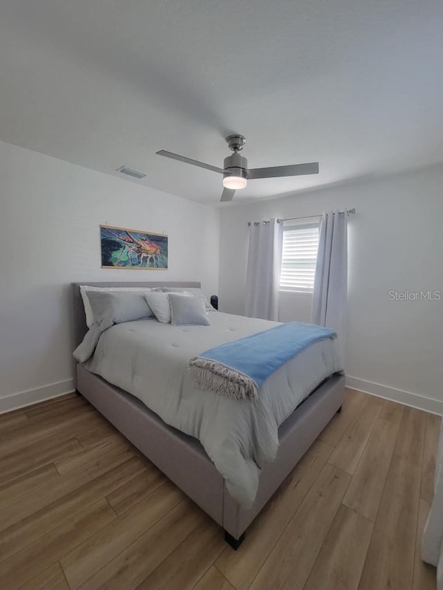 4029 9th Ave S, Saint Petersburg, FL 33711 - bedroom with light wood finished floors and ceiling fan