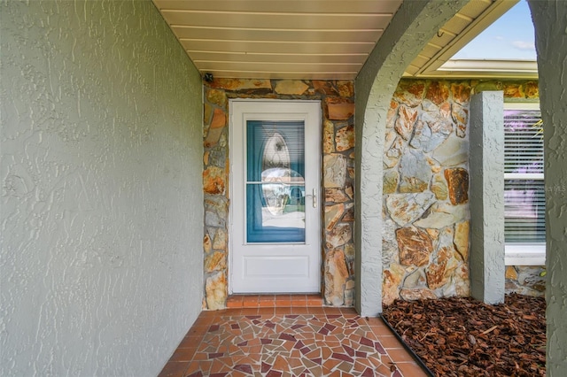13909 Berkowitz Ave, Hudson, FL 34667 - property entrance with stone siding