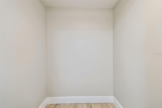 13909 Berkowitz Ave, Hudson, FL 34667 - unfurnished room featuring baseboards and light wood-style floors