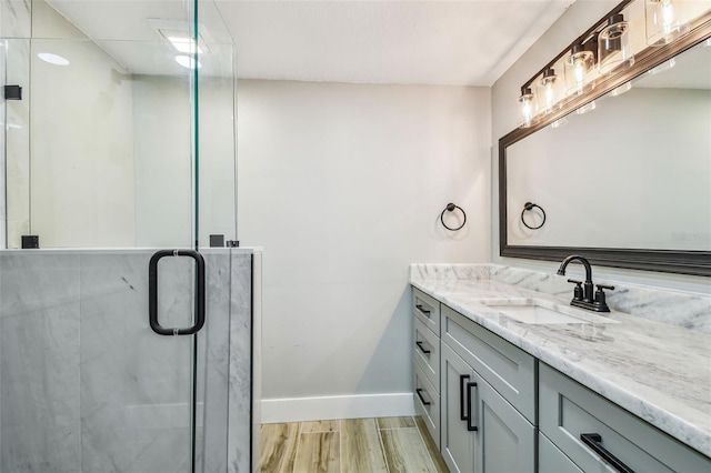 13909 Berkowitz Ave, Hudson, FL 34667 - bathroom with vanity, a stall shower, and wood finished floors
