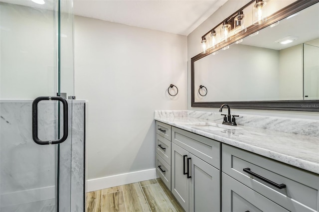 13909 Berkowitz Ave, Hudson, FL 34667 - bathroom with vanity, wood finished floors, and a shower stall