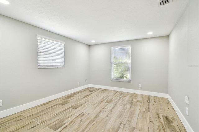 13909 Berkowitz Ave, Hudson, FL 34667 - unfurnished room featuring wood finished floors and recessed lighting