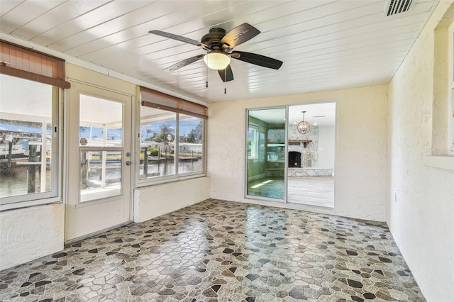 13909 Berkowitz Ave, Hudson, FL 34667 - unfurnished sunroom featuring a water view
