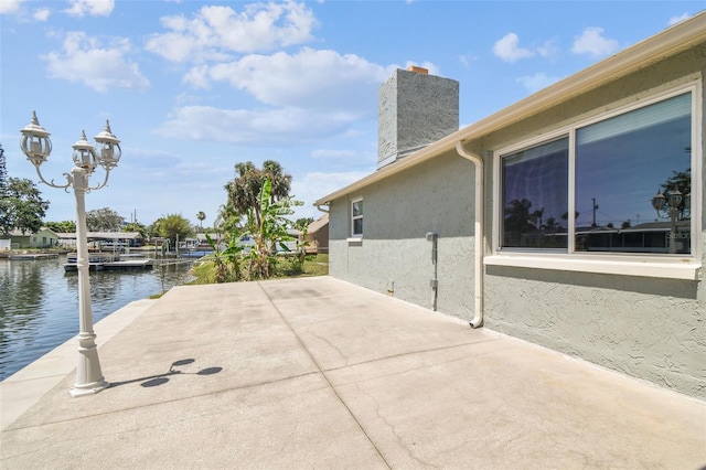 13909 Berkowitz Ave, Hudson, FL 34667 - view of patio with a water view