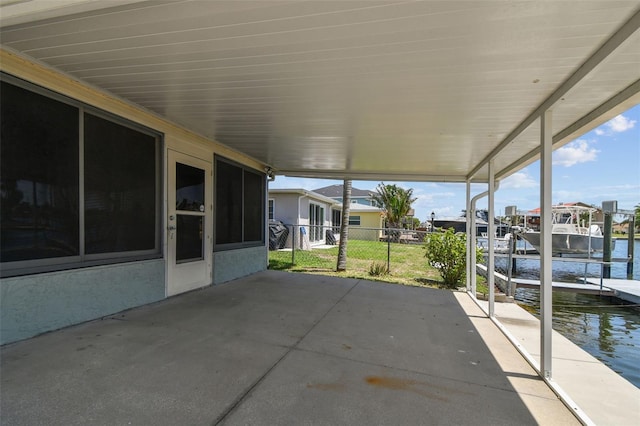 13909 Berkowitz Ave, Hudson, FL 34667 - view of patio featuring a boat dock, a water view, boat lift, and a carport