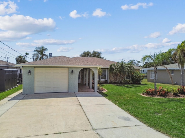 13909 Berkowitz Ave, Hudson, FL 34667 - single story home featuring stucco siding, driveway, a front lawn, and a garage