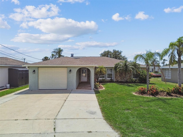 13909 Berkowitz Ave, Hudson, FL 34667 - ranch-style home featuring stucco siding, a garage, a front lawn, and driveway