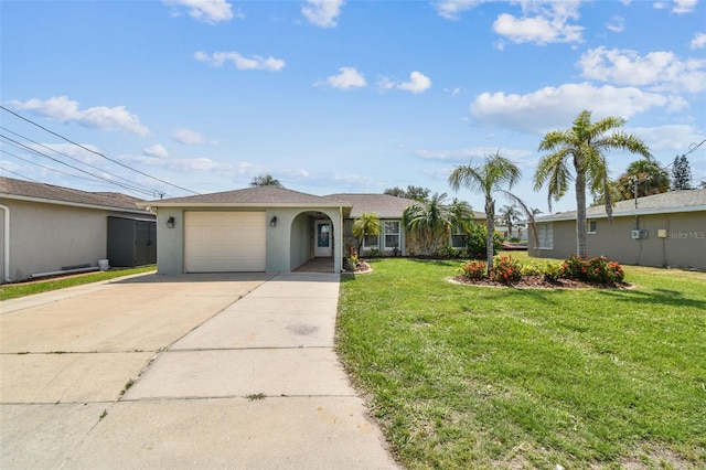 13909 Berkowitz Ave, Hudson, FL 34667 - ranch-style home featuring stucco siding, driveway, a front yard, and a garage