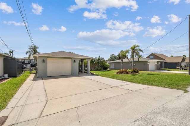 13909 Berkowitz Ave, Hudson, FL 34667 - ranch-style house with stucco siding, a front lawn, and concrete driveway