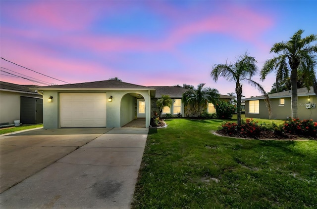 13909 Berkowitz Ave, Hudson, FL 34667 - single story home featuring stucco siding, a garage, driveway, and a lawn