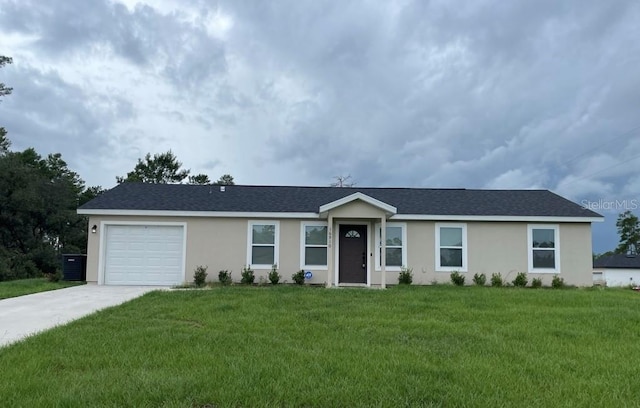 16910 SW 27th Ave, Ocala, FL 34473 - ranch-style home featuring stucco siding, a garage, concrete driveway, and a front lawn
