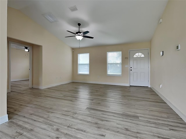 16910 SW 27th Ave, Ocala, FL 34473 - unfurnished living room with a ceiling fan, vaulted ceiling, and wood finished floors