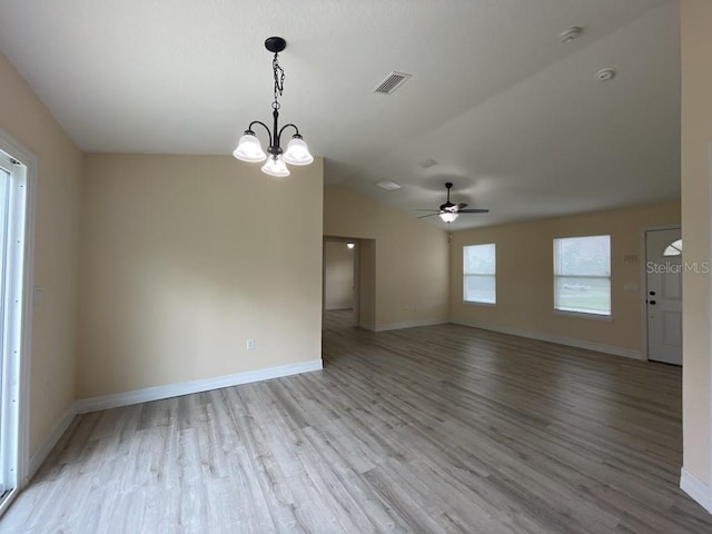 16910 SW 27th Ave, Ocala, FL 34473 - empty room with a smoke detector, light wood-style flooring, a ceiling fan, a chandelier, and lofted ceiling