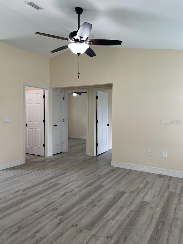 16910 SW 27th Ave, Ocala, FL 34473 - empty room featuring a ceiling fan, wood finished floors, and high vaulted ceiling