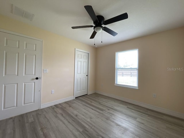 16910 SW 27th Ave, Ocala, FL 34473 - unfurnished bedroom featuring wood finished floors and ceiling fan