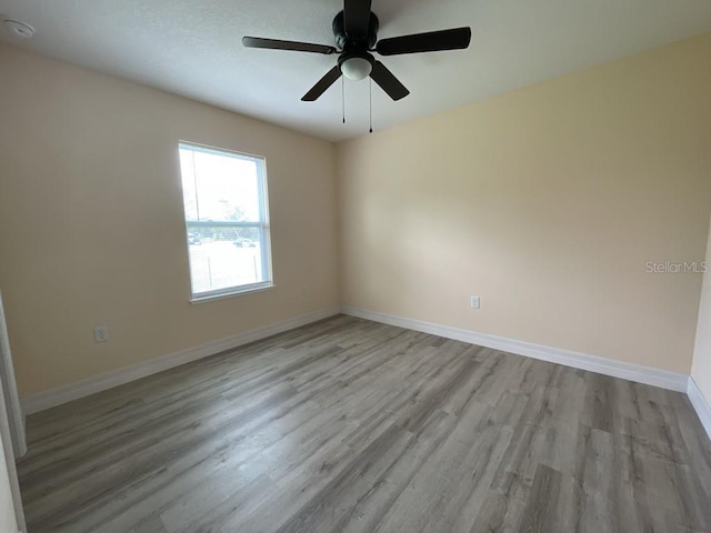 16910 SW 27th Ave, Ocala, FL 34473 - spare room featuring wood finished floors, a ceiling fan, and a smoke detector