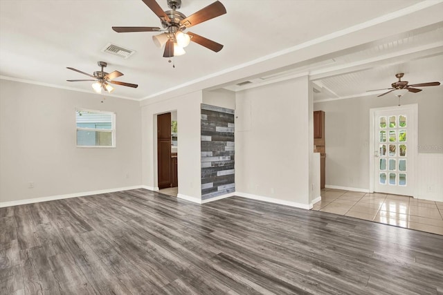 10375 106th Ter, Largo, FL 33773 - unfurnished living room featuring a ceiling fan, wood finished floors, and crown molding