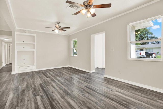 10375 106th Ter, Largo, FL 33773 - spare room with ceiling fan, dark wood-type flooring, and crown molding