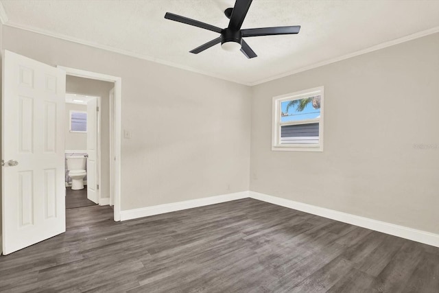 10375 106th Ter, Largo, FL 33773 - empty room featuring crown molding, dark wood-style floors, and a ceiling fan